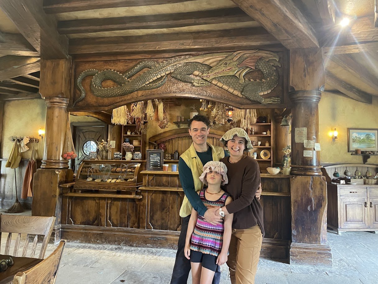 Eliza, Sam, and Annie Grove outside the Green Dragon Inn at Hobbiton
